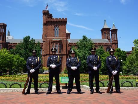 The SI Honor Guard standing in front of the Smithsonian Castle